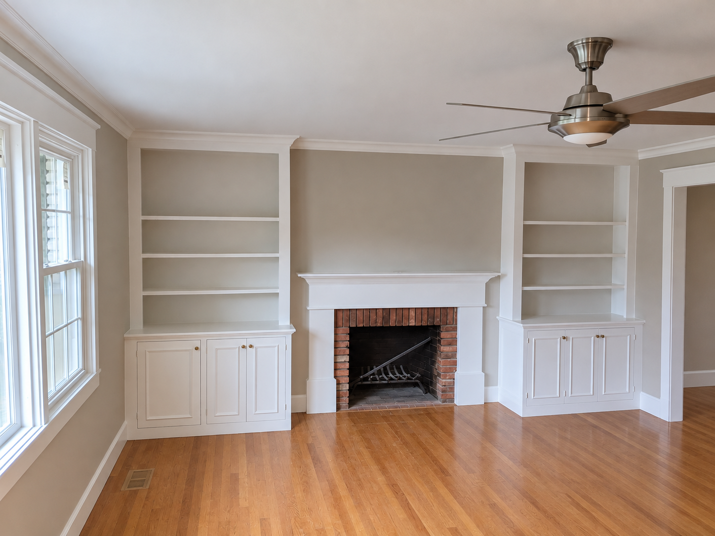 Classic fireplace wall with white built-in shelving