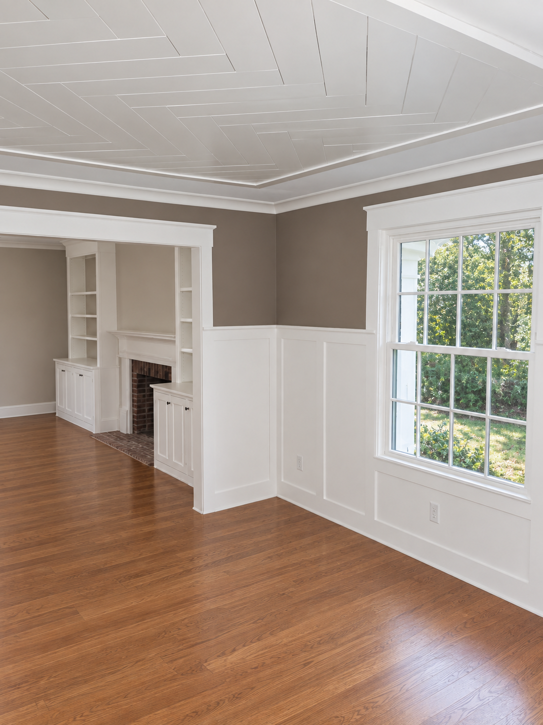 Finished living room with fireplace and built-in shelving