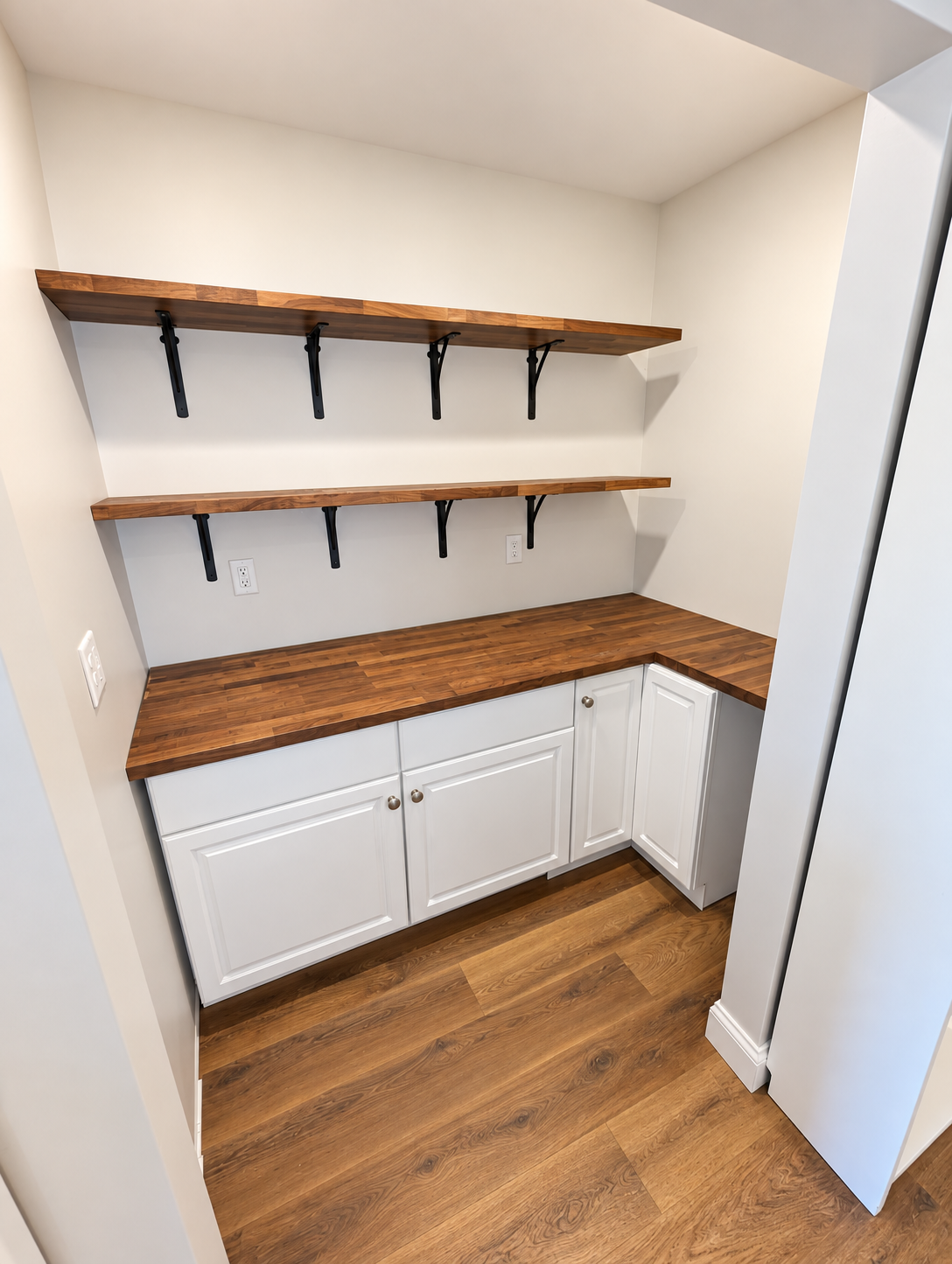 Finished pantry with custom shelving and white trim